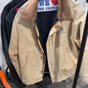 Vintage Carhartt jacket with lots of wear and tear.